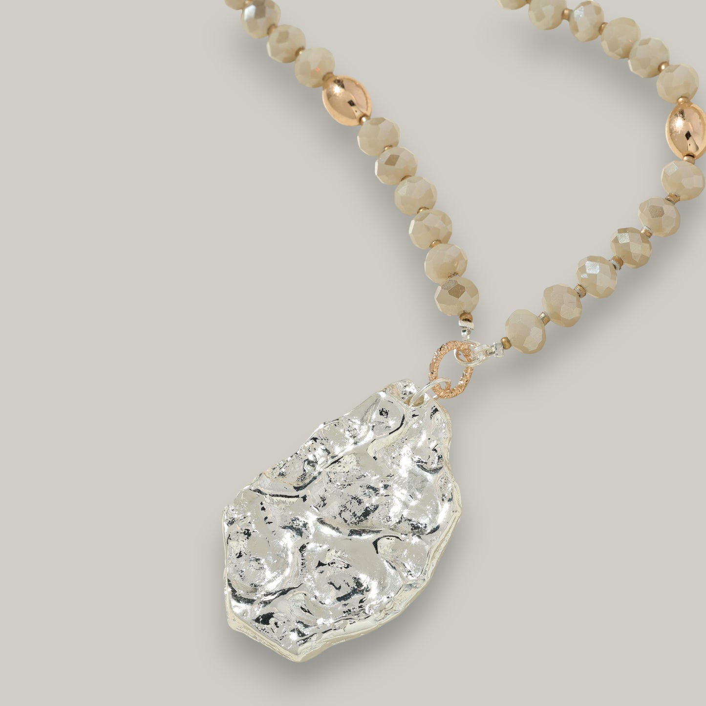 Merx - Beaded Necklace with a Hammered Silver Pendant
