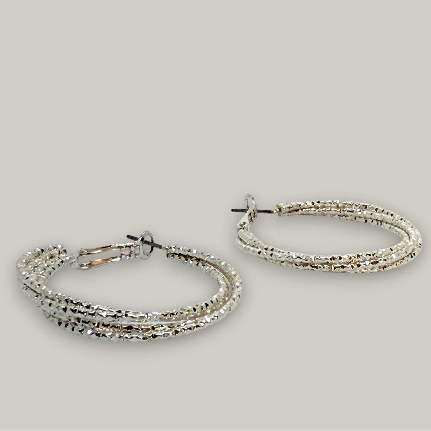 EL-KA - Twisted Radiance Hoop Earrings