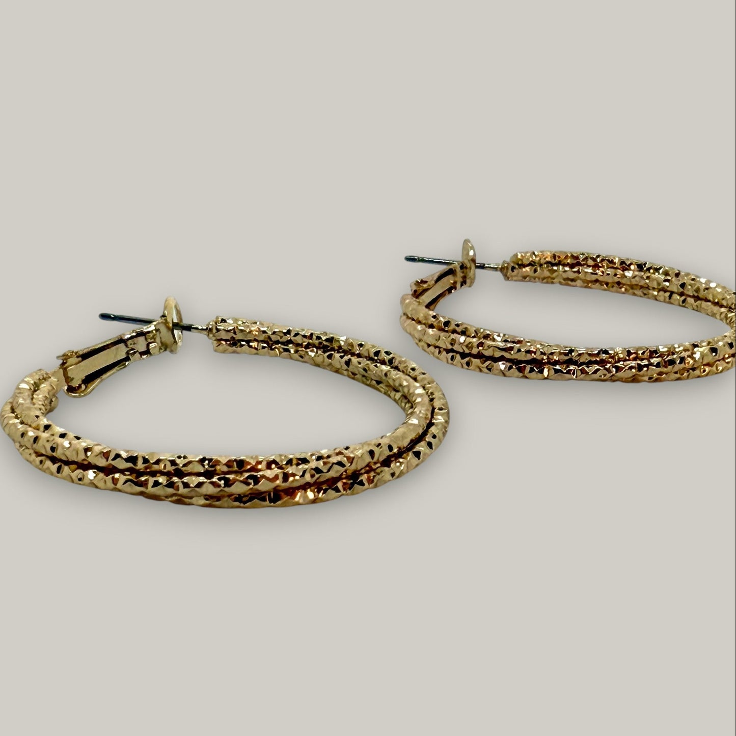 EL-KA - Twisted Radiance Hoop Earrings